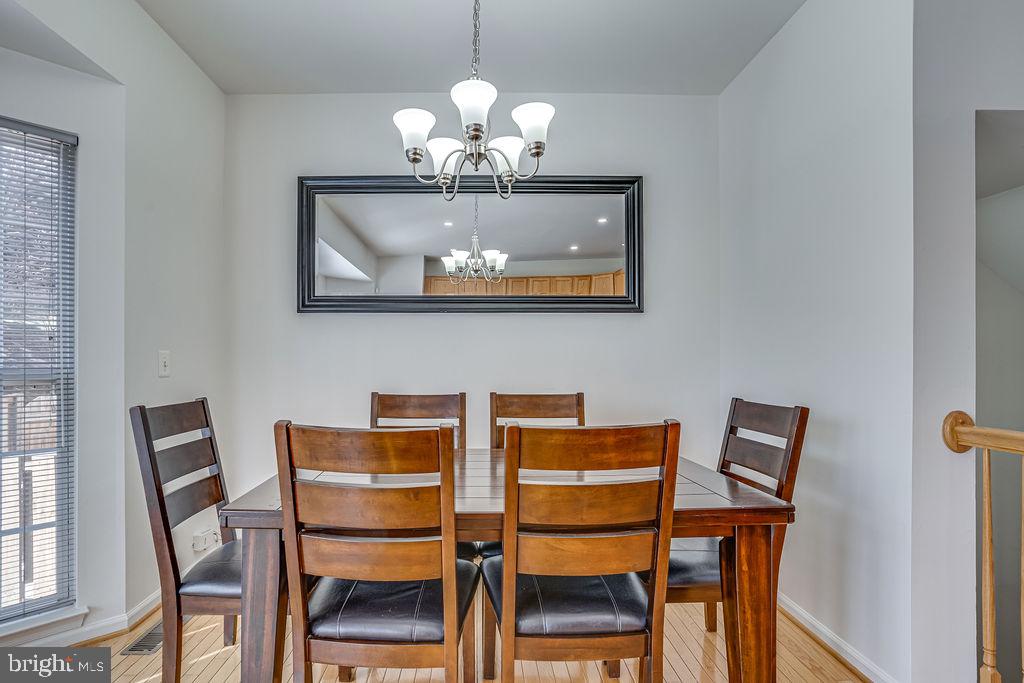 13262 Revillo Loop Woodbridge, VA 22191 - Photo 9 of 32 Elegant dining space with natural light.