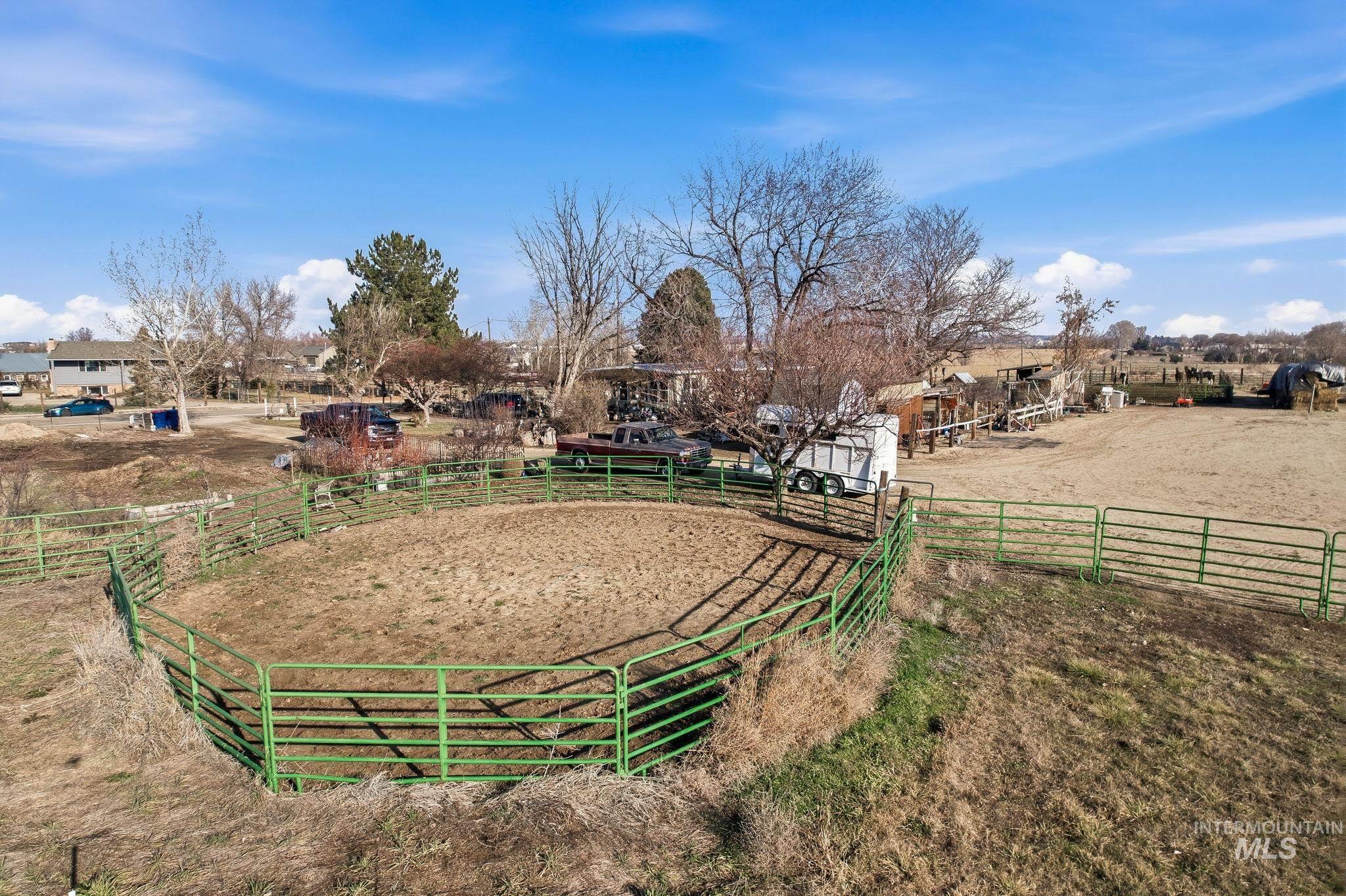 603 East King Road Kuna, ID 83634 - Photo 11 of 24 View of yard with an enclosed riding area and a rural view