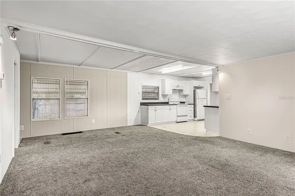 a view of a kitchen with a sink and cabinets