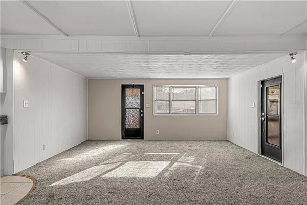 a view of an empty room with a window