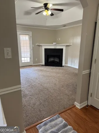 wooden floor in an empty room with a fireplace