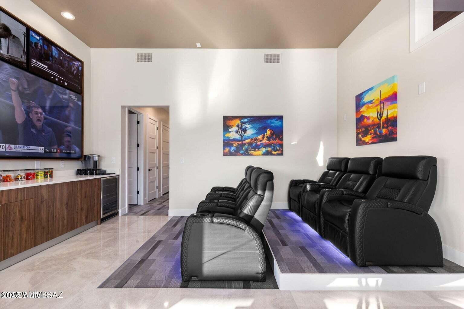 5901 West El Camino Del Cerro Tucson, AZ 85745 - Photo 20 of 50 a living room with furniture and a flat screen tv