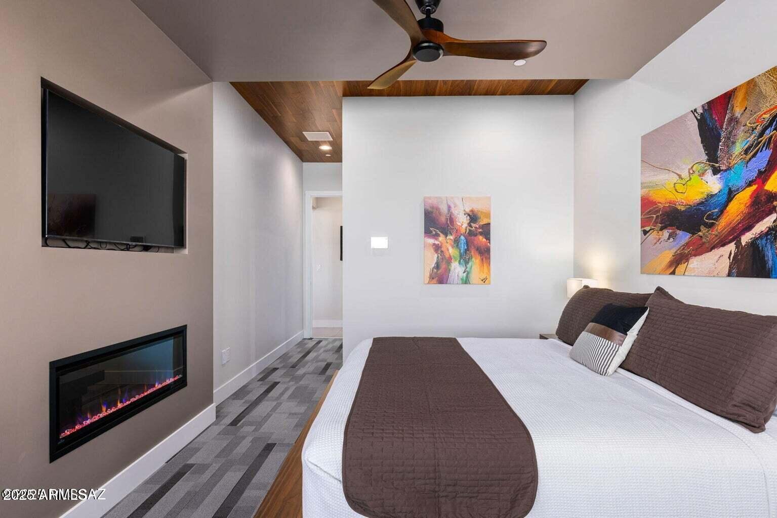 5901 West El Camino Del Cerro Tucson, AZ 85745 - Photo 22 of 50 a bedroom with a bed and a television