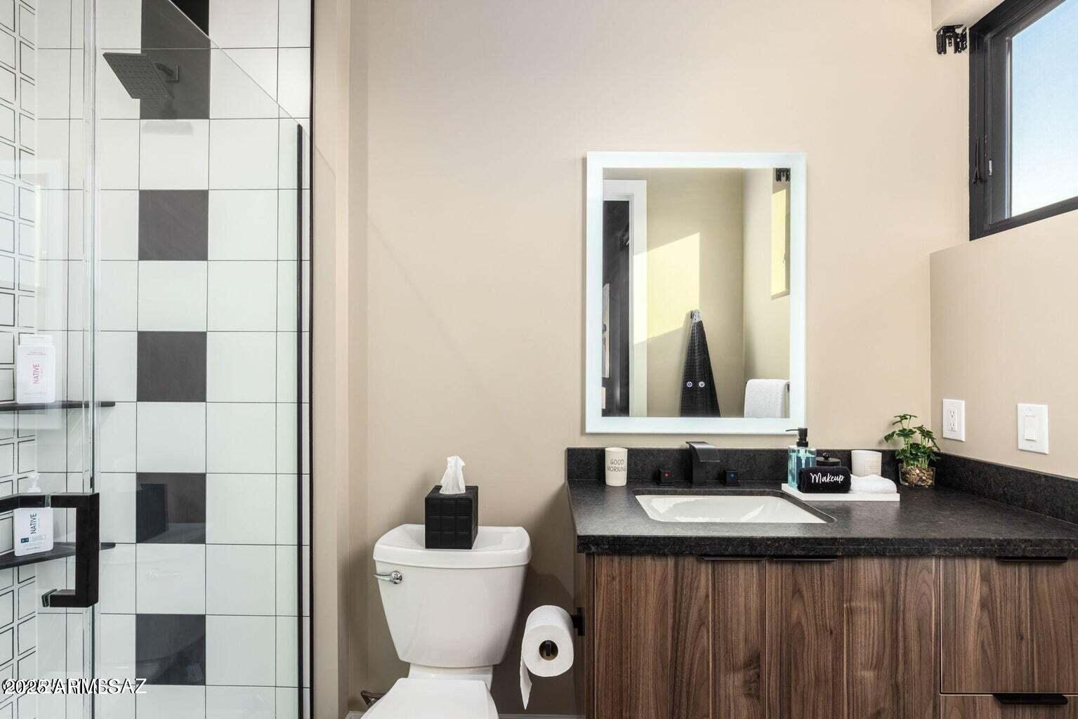 5901 West El Camino Del Cerro Tucson, AZ 85745 - Photo 26 of 50 a bathroom with a sink and a mirror