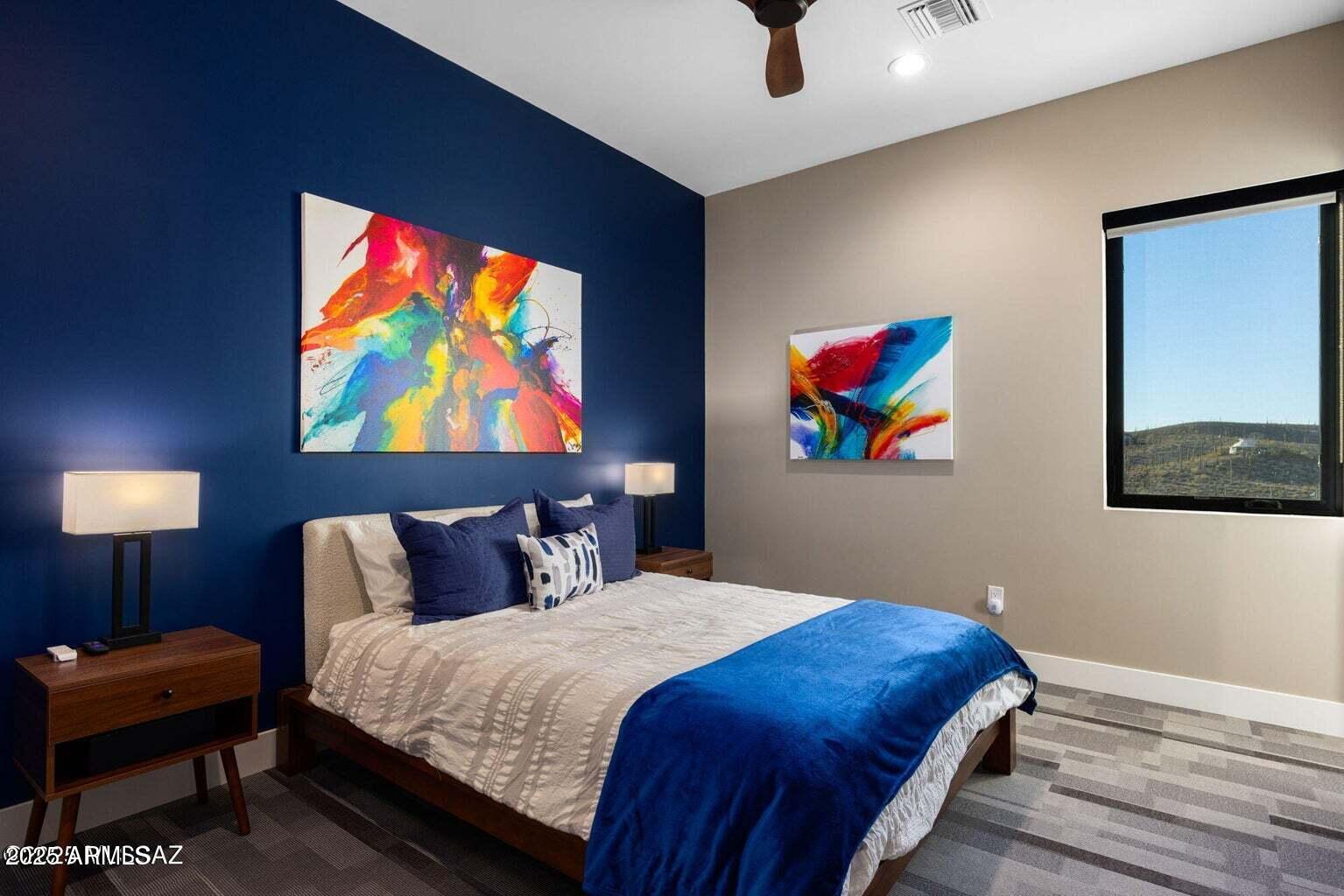 5901 West El Camino Del Cerro Tucson, AZ 85745 - Photo 28 of 50 a bedroom with a bed and a painting on the wall