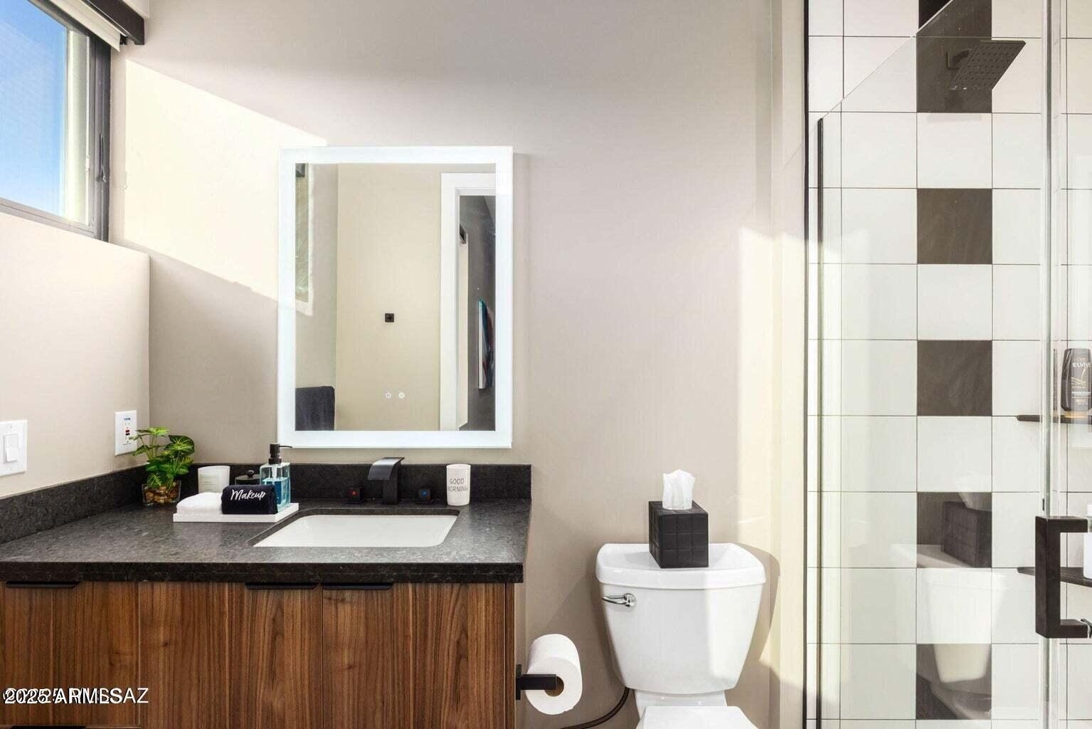 5901 West El Camino Del Cerro Tucson, AZ 85745 - Photo 30 of 50 a bathroom with a sink and a mirror