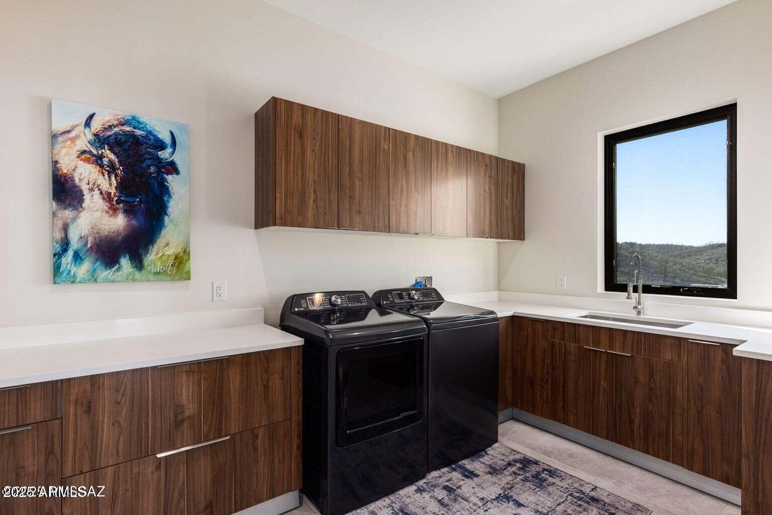5901 West El Camino Del Cerro Tucson, AZ 85745 - Photo 34 of 50 a kitchen with a sink and cabinets
