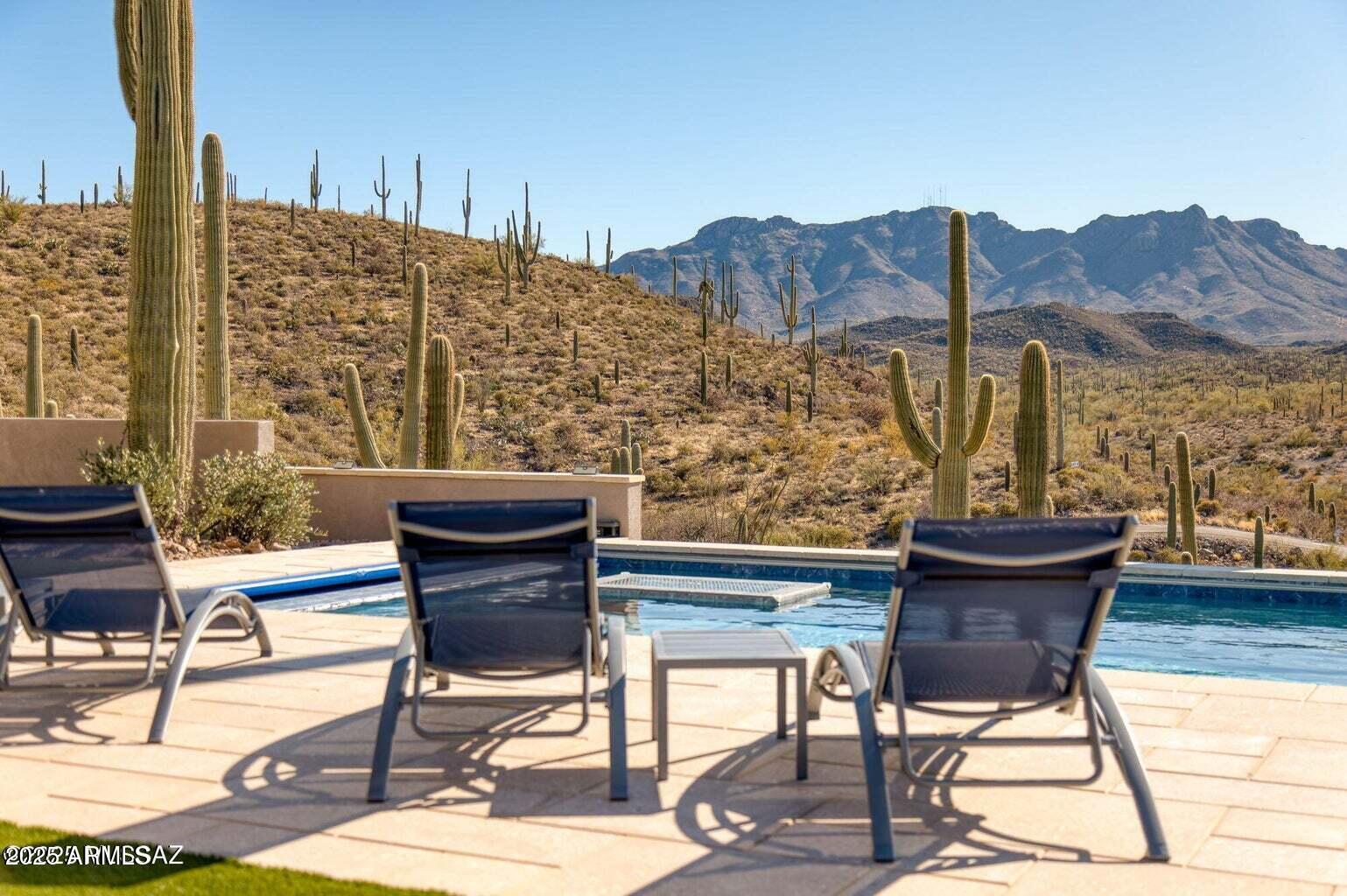5901 West El Camino Del Cerro Tucson, AZ 85745 - Photo 35 of 50 a view of a patio with table and chairs