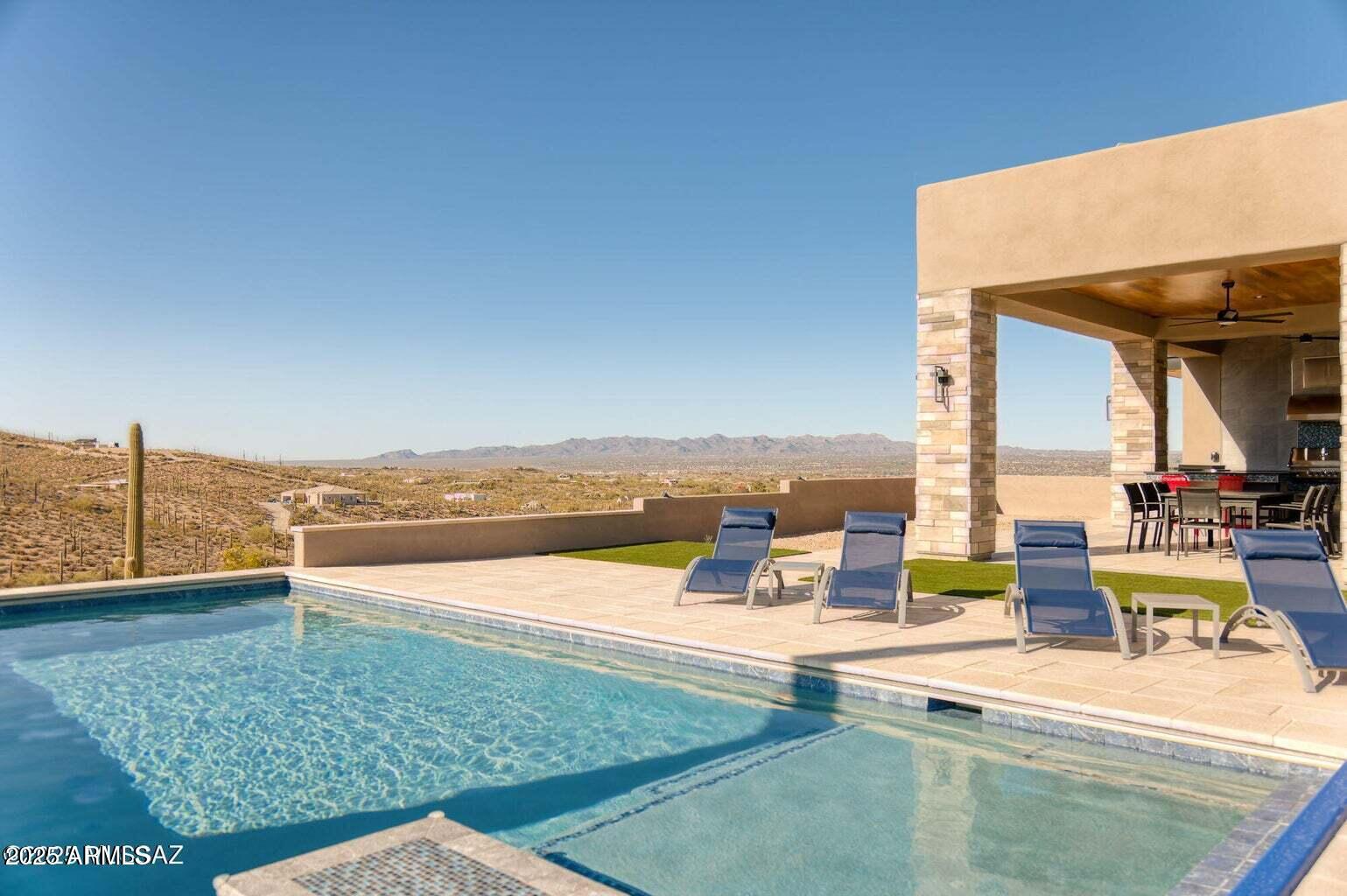 5901 West El Camino Del Cerro Tucson, AZ 85745 - Photo 36 of 50 a view of a swimming pool with an ocean view