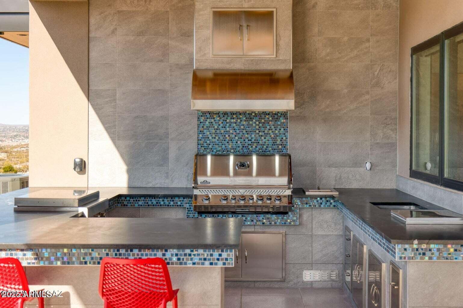 5901 West El Camino Del Cerro Tucson, AZ 85745 - Photo 40 of 50 a kitchen with granite countertop a stove and a sink