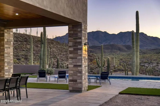 a view of a dining room with furniture and a floor to ceiling window
