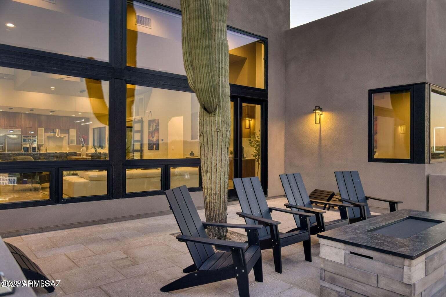 5901 West El Camino Del Cerro Tucson, AZ 85745 - Photo 44 of 50 a view of a dining room with furniture and a floor to ceiling window