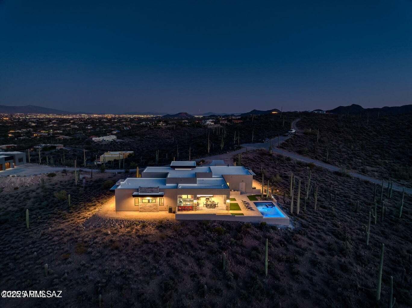 5901 West El Camino Del Cerro Tucson, AZ 85745 - Photo 49 of 50 a view of a swimming pool with a lake view