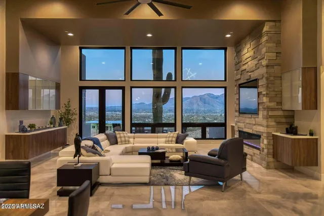 a living room with furniture and a floor to ceiling window