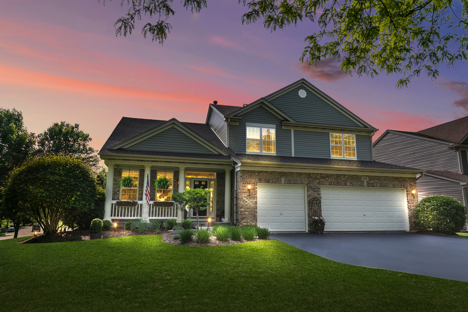 front view of a house with a yard