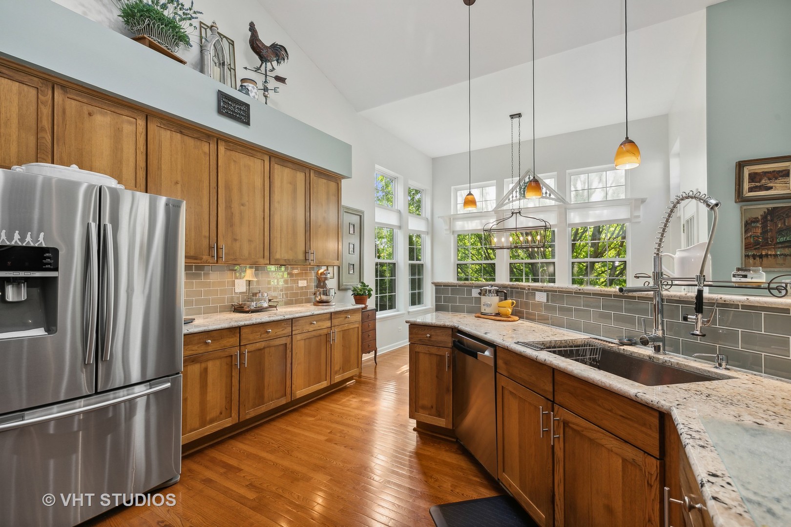 385 Sterling Circle Cary, IL 60013 - Photo 11 of 31 a kitchen with stainless steel appliances granite countertop a sink stove and refrigerator