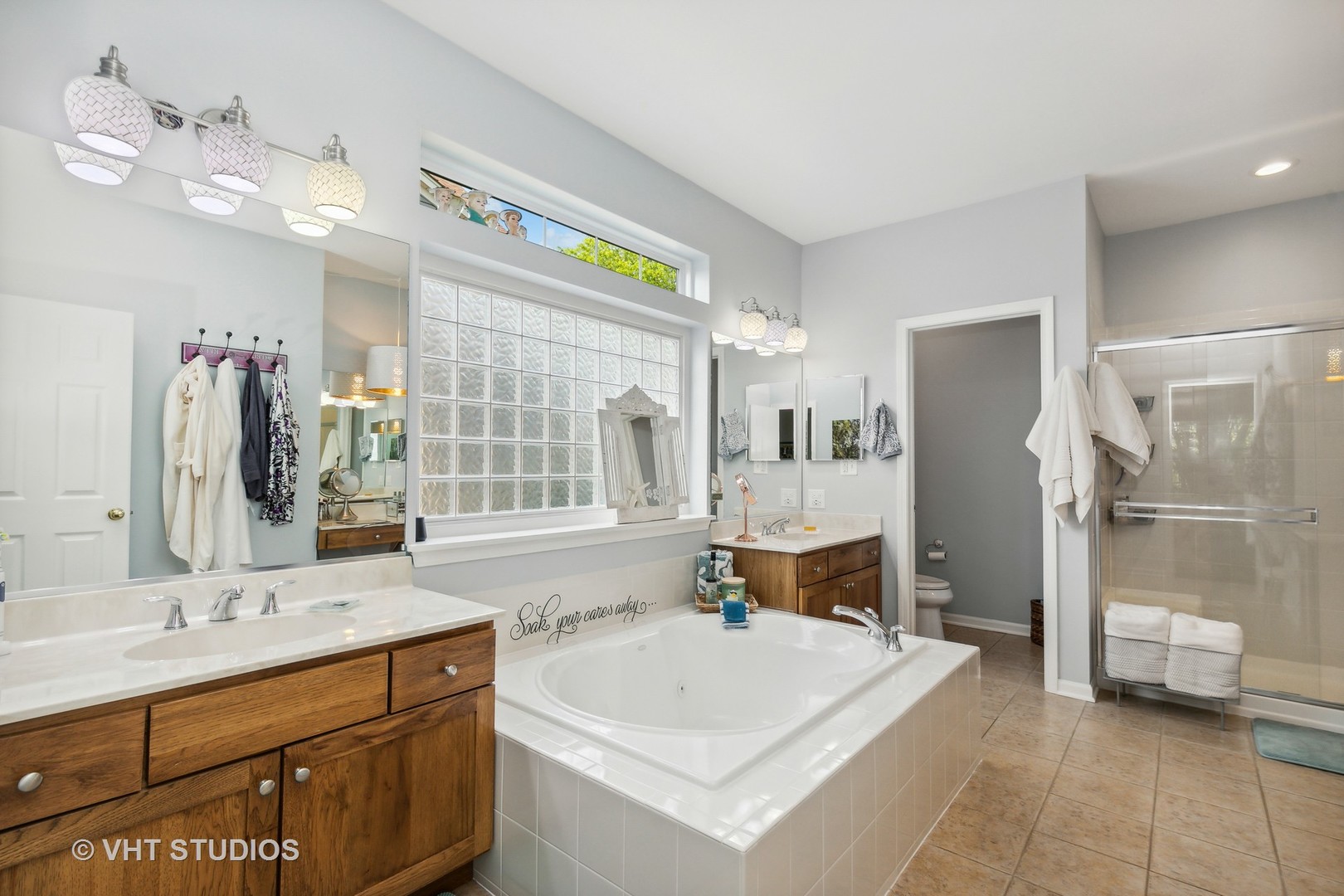 385 Sterling Circle Cary, IL 60013 - Photo 14 of 31 a spacious bathroom with a tub sink and mirror