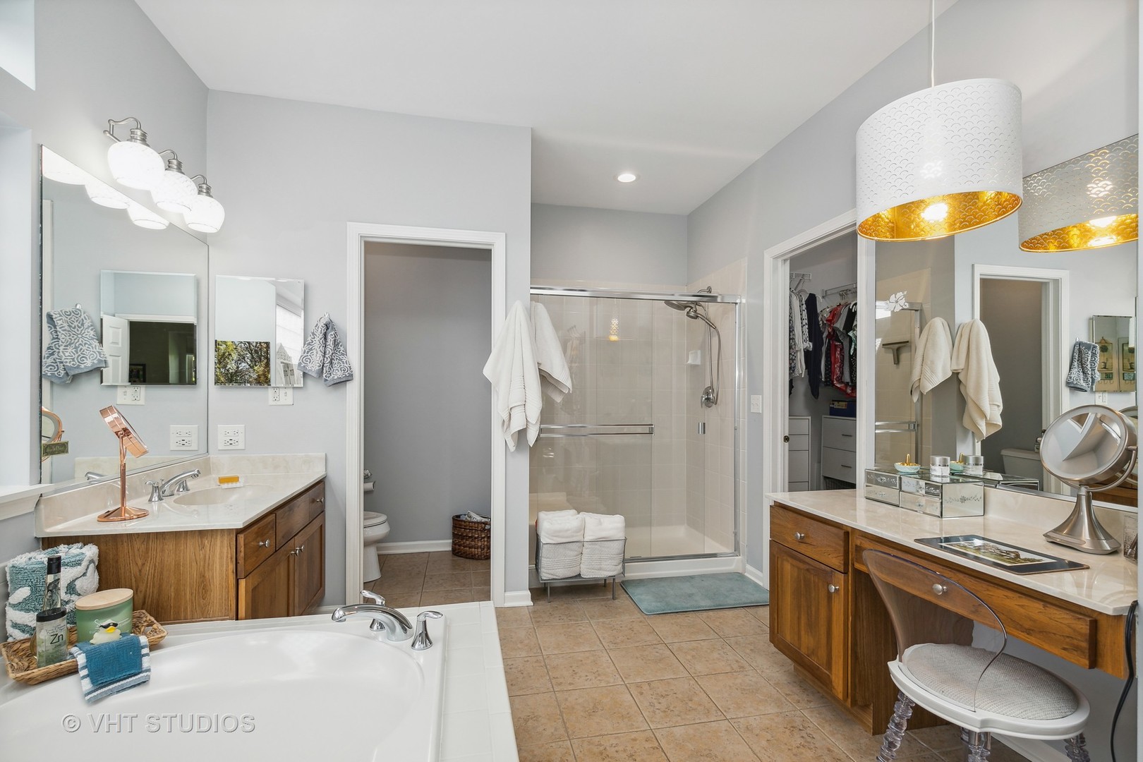 385 Sterling Circle Cary, IL 60013 - Photo 15 of 31 a bathroom with a tub sink and mirror