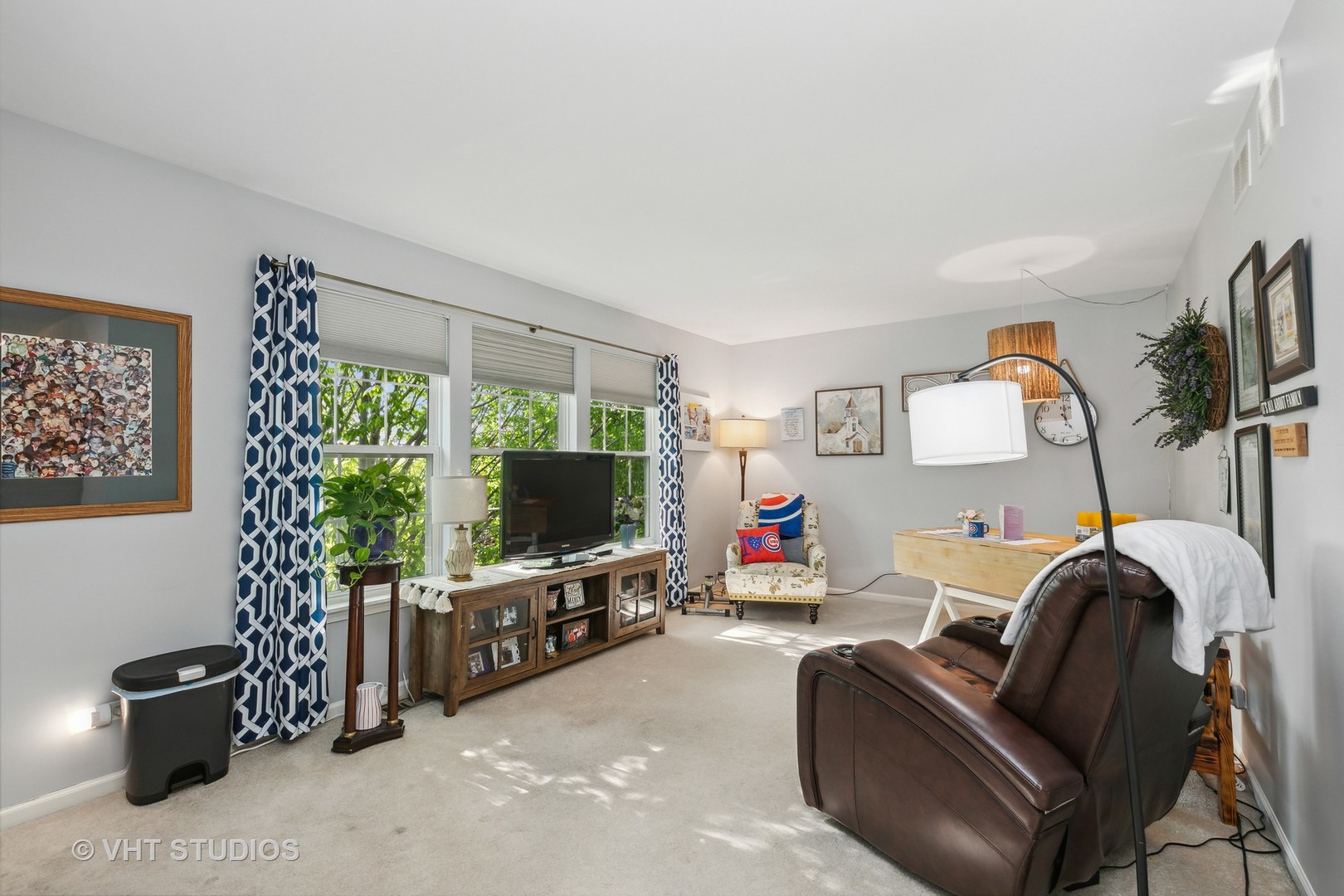 385 Sterling Circle Cary, IL 60013 - Photo 17 of 31 a living room with furniture and a flat screen tv
