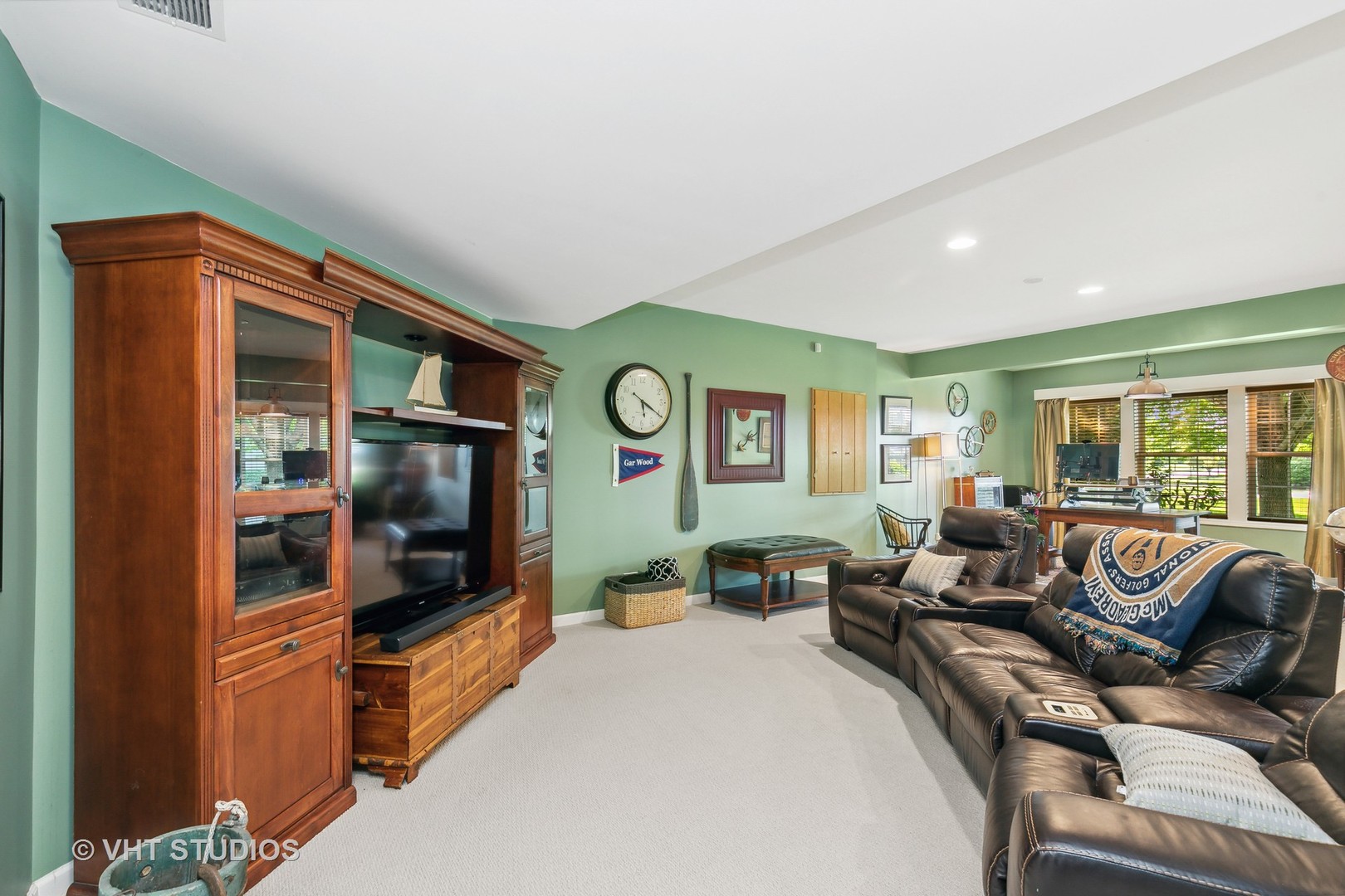 385 Sterling Circle Cary, IL 60013 - Photo 18 of 31 a living room with furniture and a flat screen tv