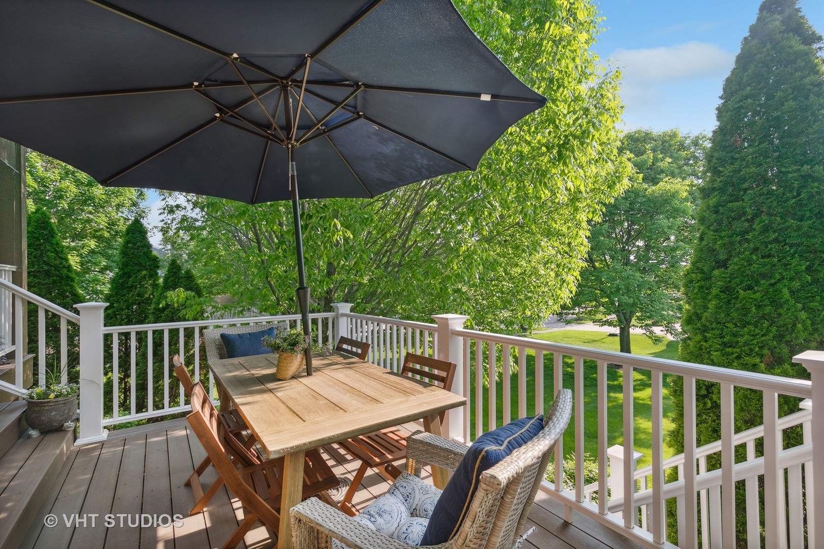 385 Sterling Circle Cary, IL 60013 - Photo 24 of 31 a view of balcony with furniture and umbrella