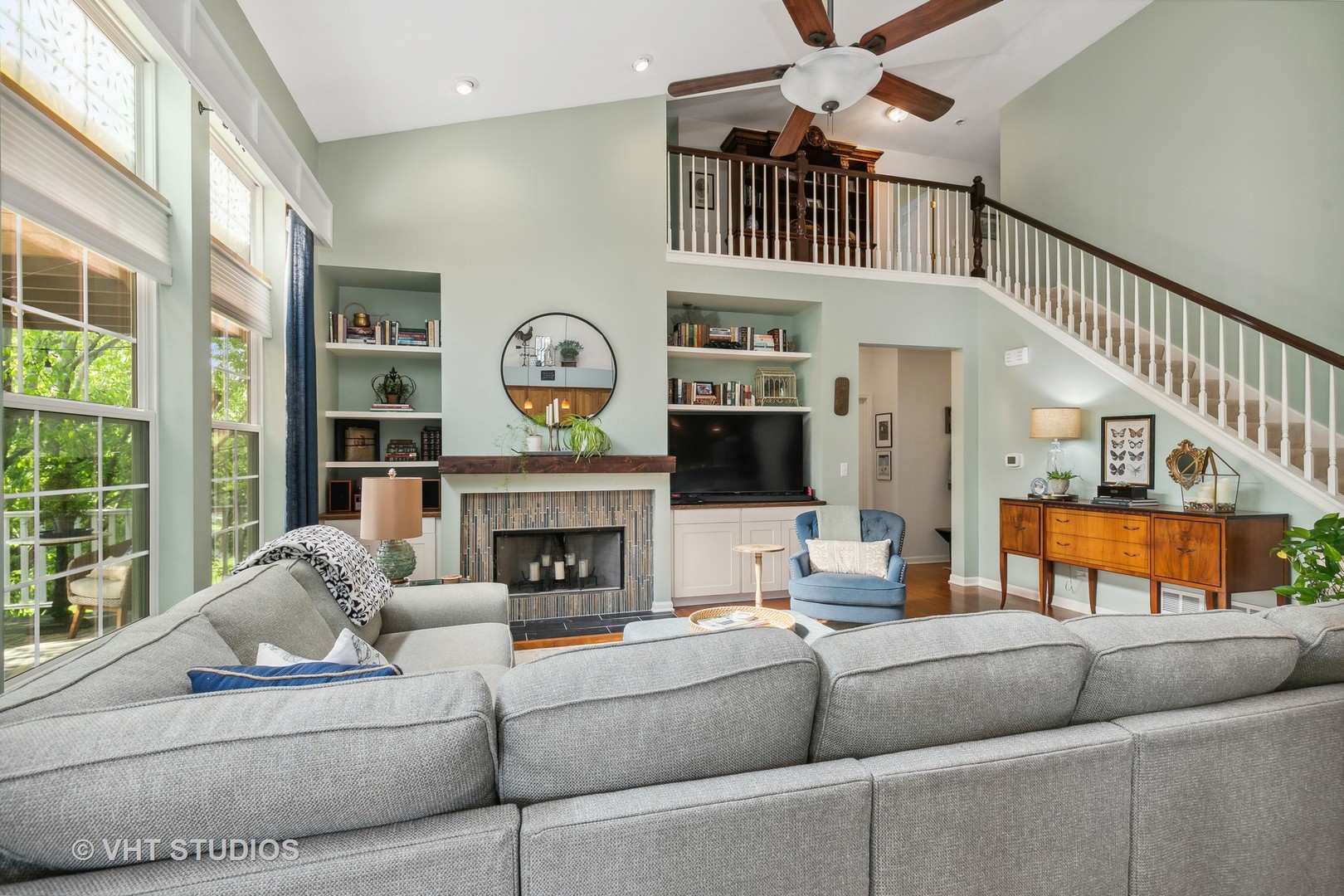 385 Sterling Circle Cary, IL 60013 - Photo 8 of 31 a living room with furniture and a fireplace