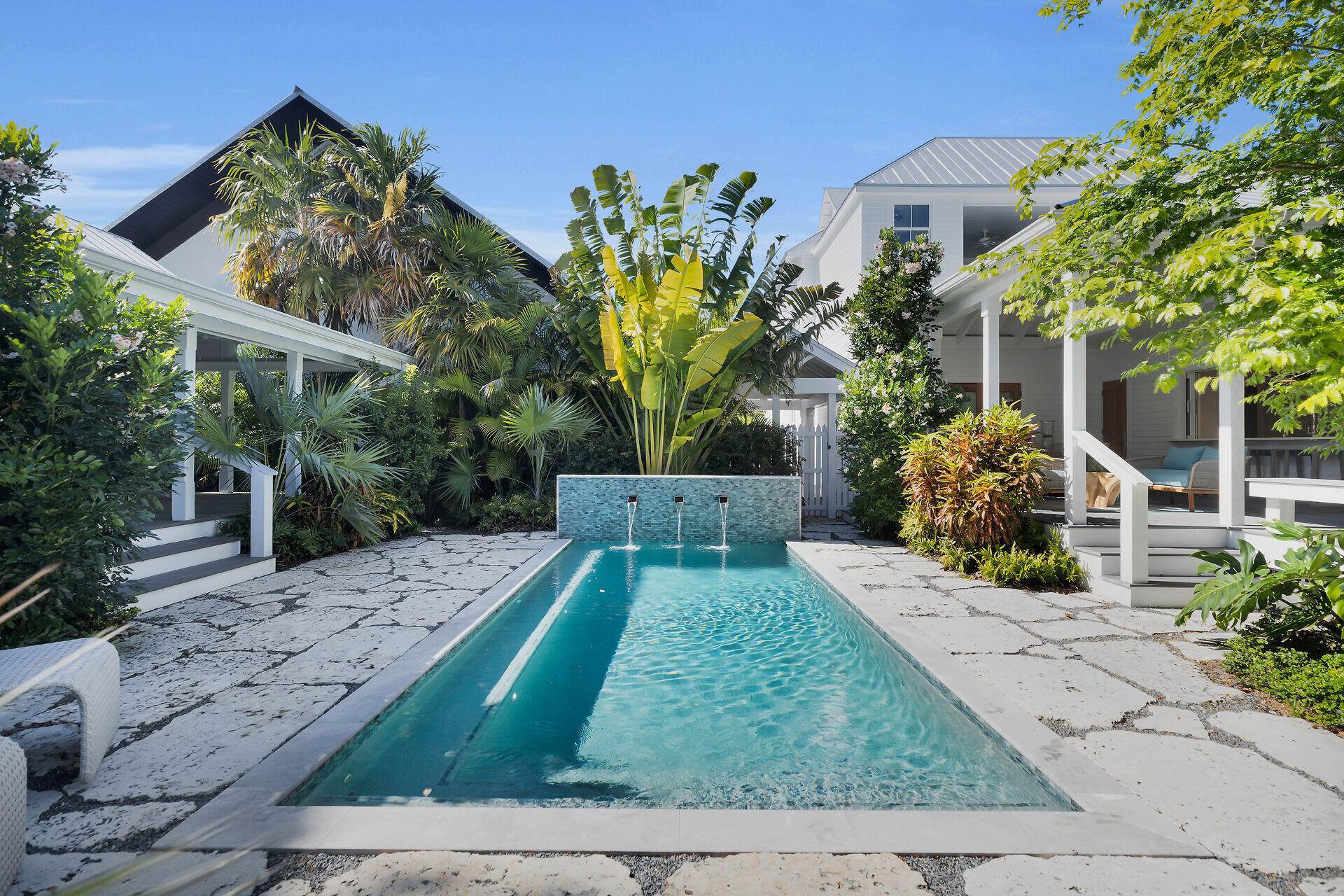 616 Eaton Street Key West, FL 33040 - Photo 11 of 62 a front view of a house with garden