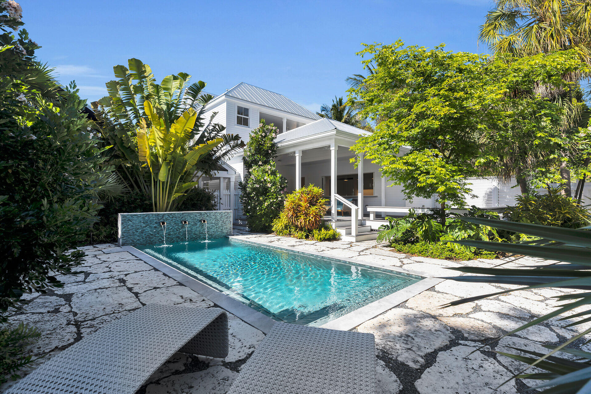 616 Eaton Street Key West, FL 33040 - Photo 12 of 62 a view of a backyard with plants and a patio