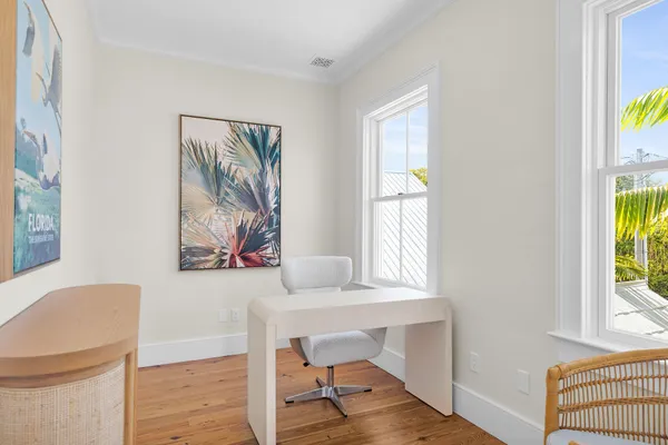 a kitchen with stainless steel appliances granite countertop a sink and a white cabinets