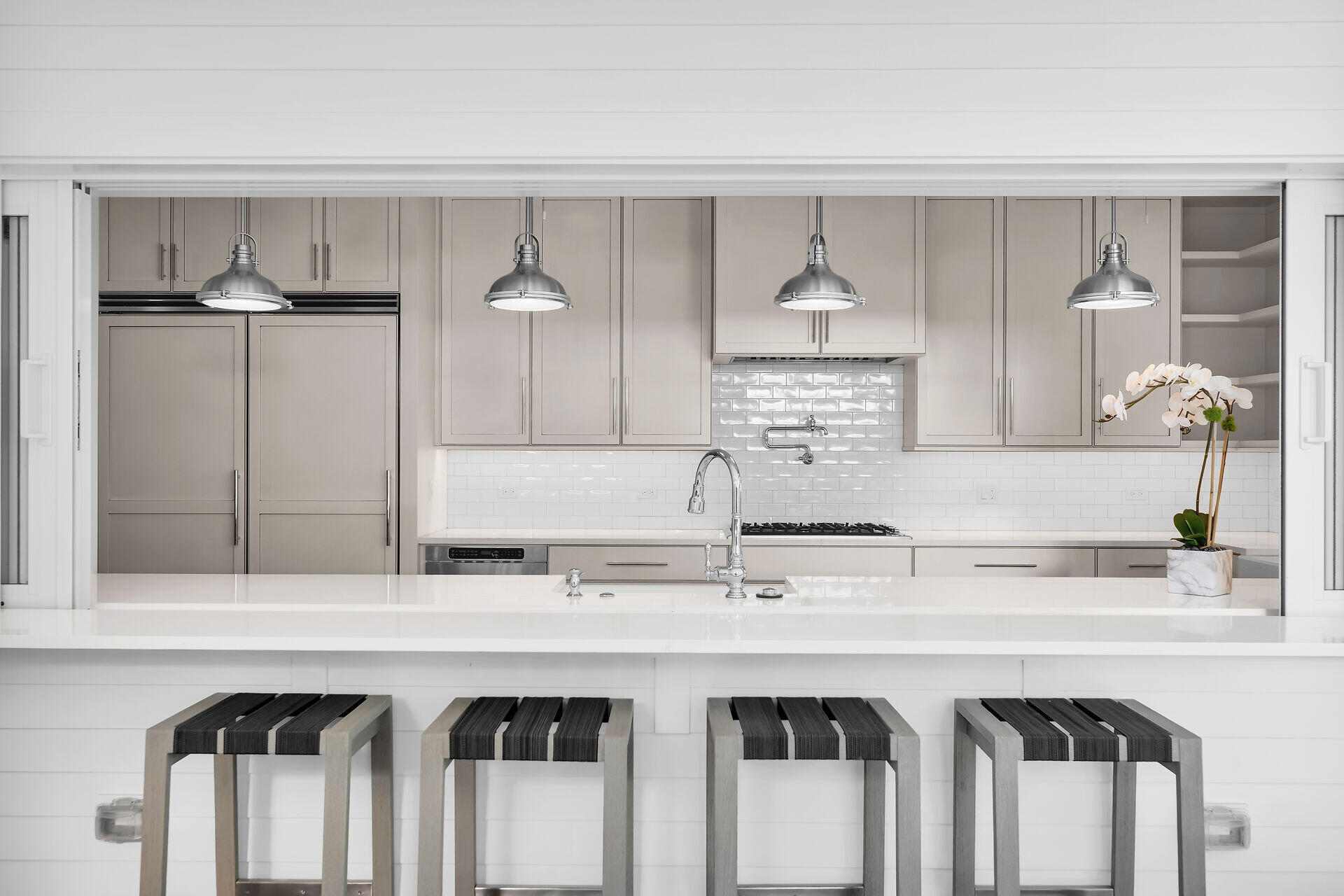 616 Eaton Street Key West, FL 33040 - Photo 25 of 62 a kitchen with stainless steel appliances granite countertop a sink and a white cabinets