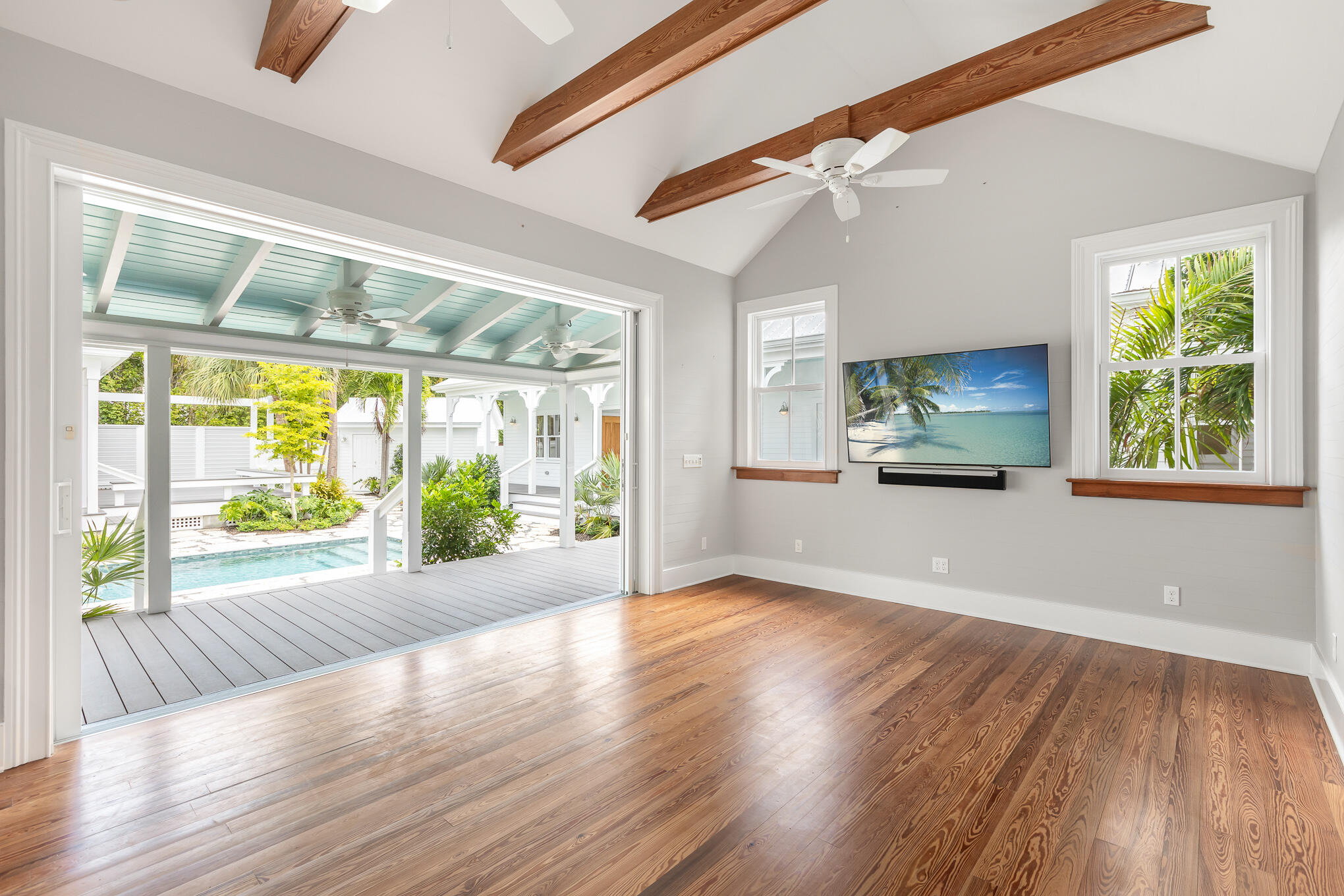616 Eaton Street Key West, FL 33040 - Photo 32 of 62 a view of an empty room with wooden floor and a window