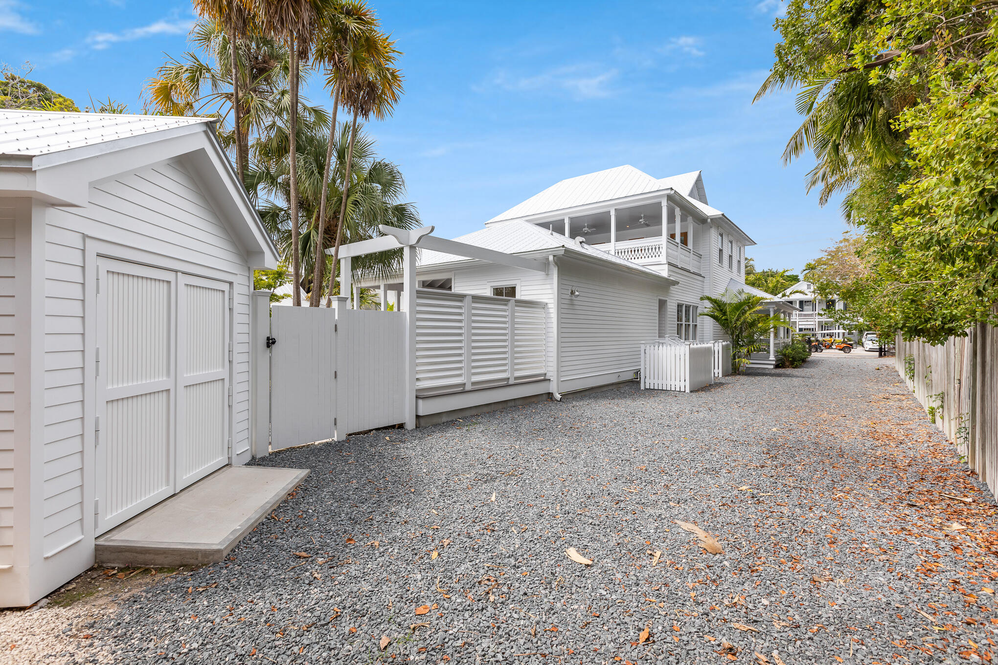 616 Eaton Street Key West, FL 33040 - Photo 52 of 62 a view of a white house with a yard and garage