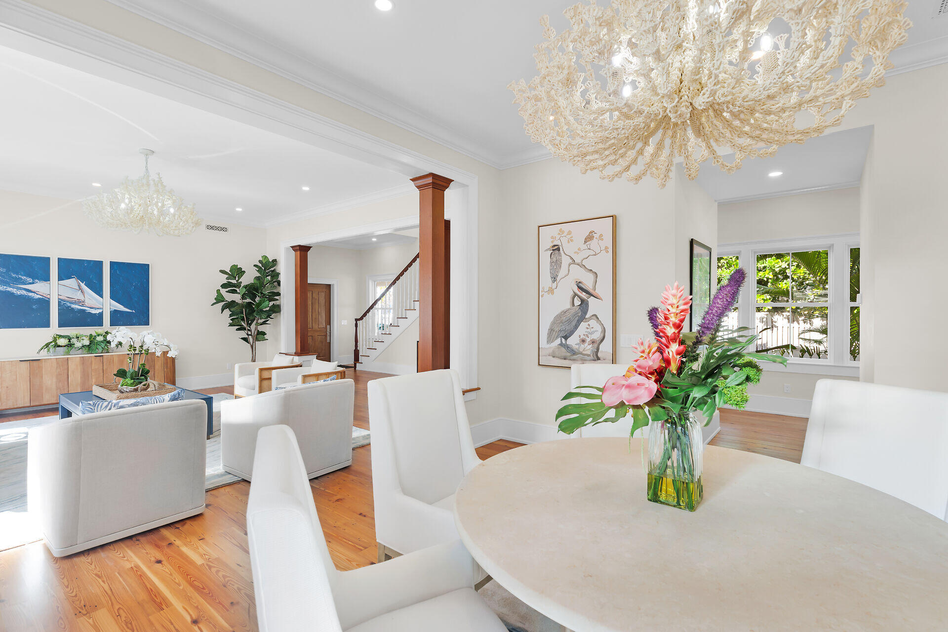 616 Eaton Street Key West, FL 33040 - Photo 6 of 62 a dining room with furniture a chandelier and wooden floor