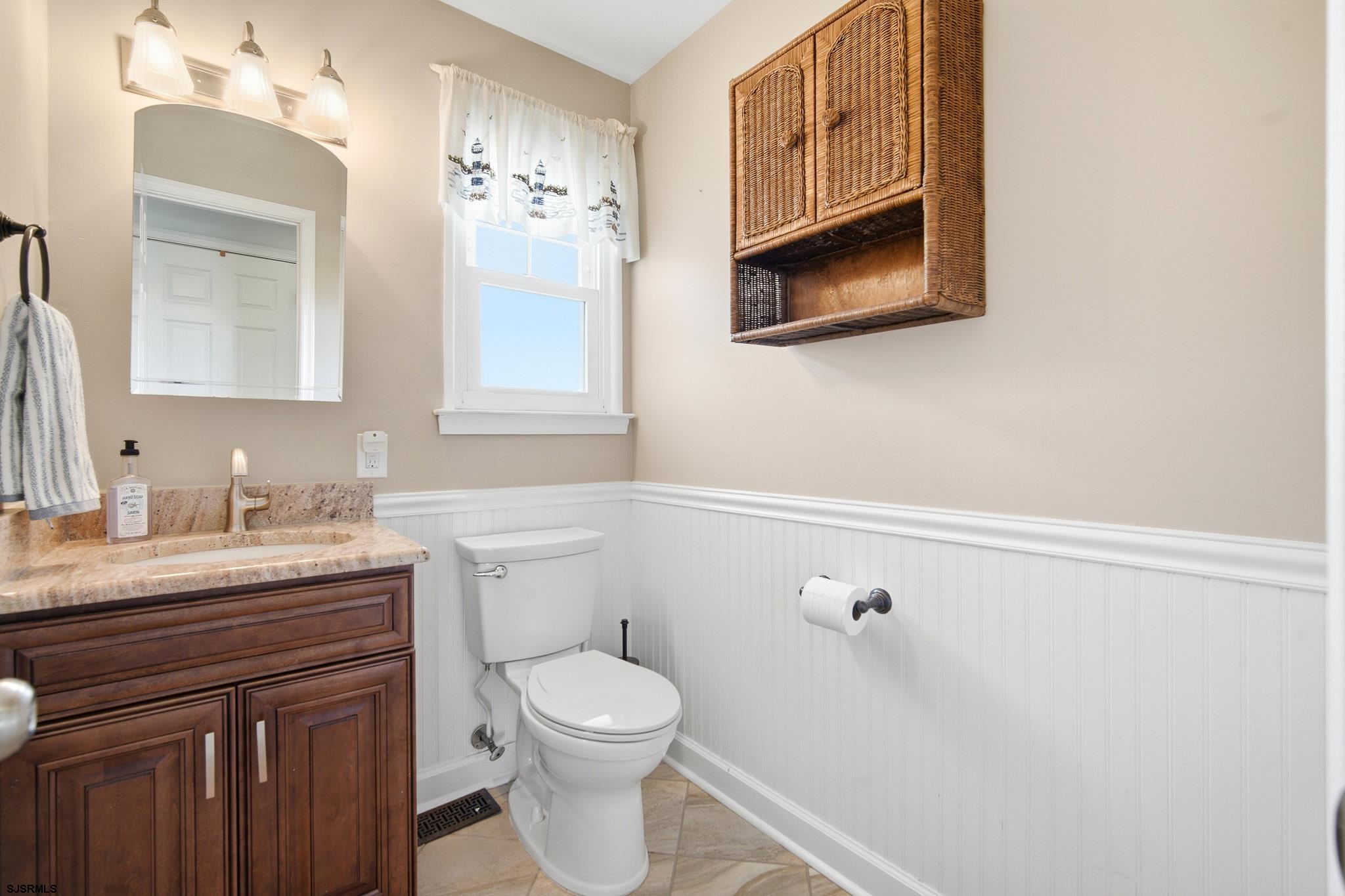 214 Hagen Road Brigantine, NJ 08203 - Photo 19 of 34 a bathroom with a granite countertop sink mirror and toilet