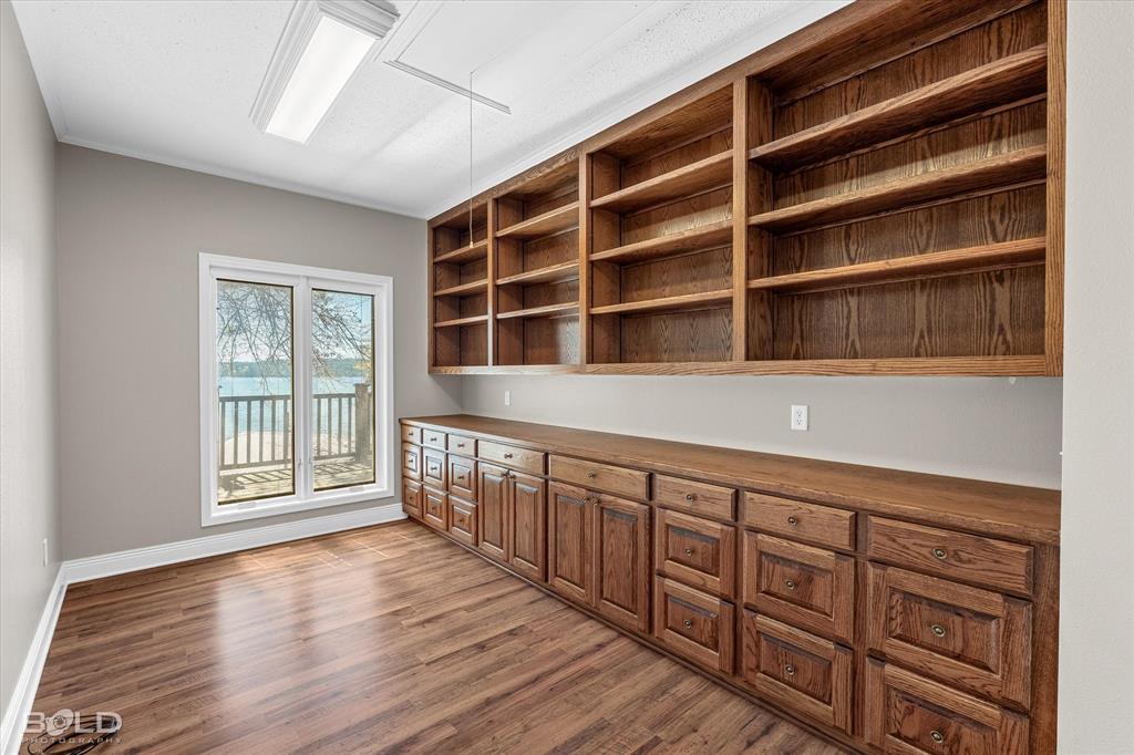 429 Robinson Lane Homer, LA 71040 - Photo 33 of 40 a hallway with wooden cabinets and a window