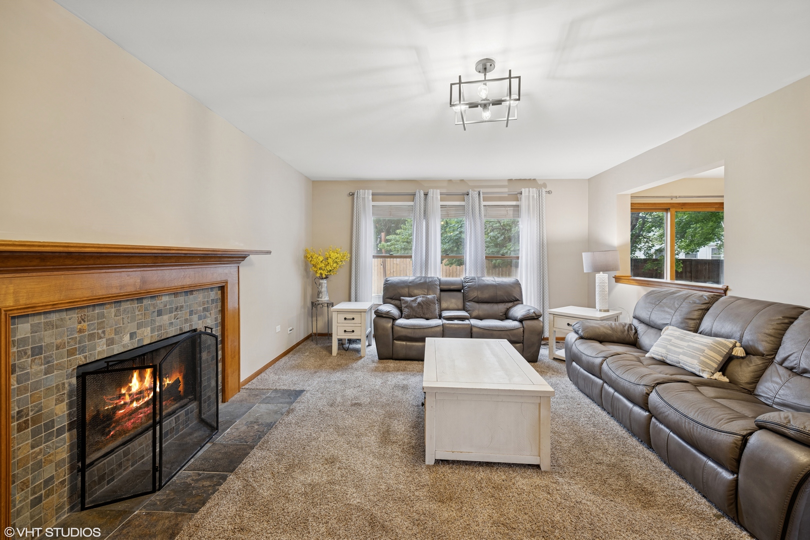 1177 Dovercliff Way Crystal Lake, IL 60014 - Photo 12 of 32 a living room with furniture and a fireplace