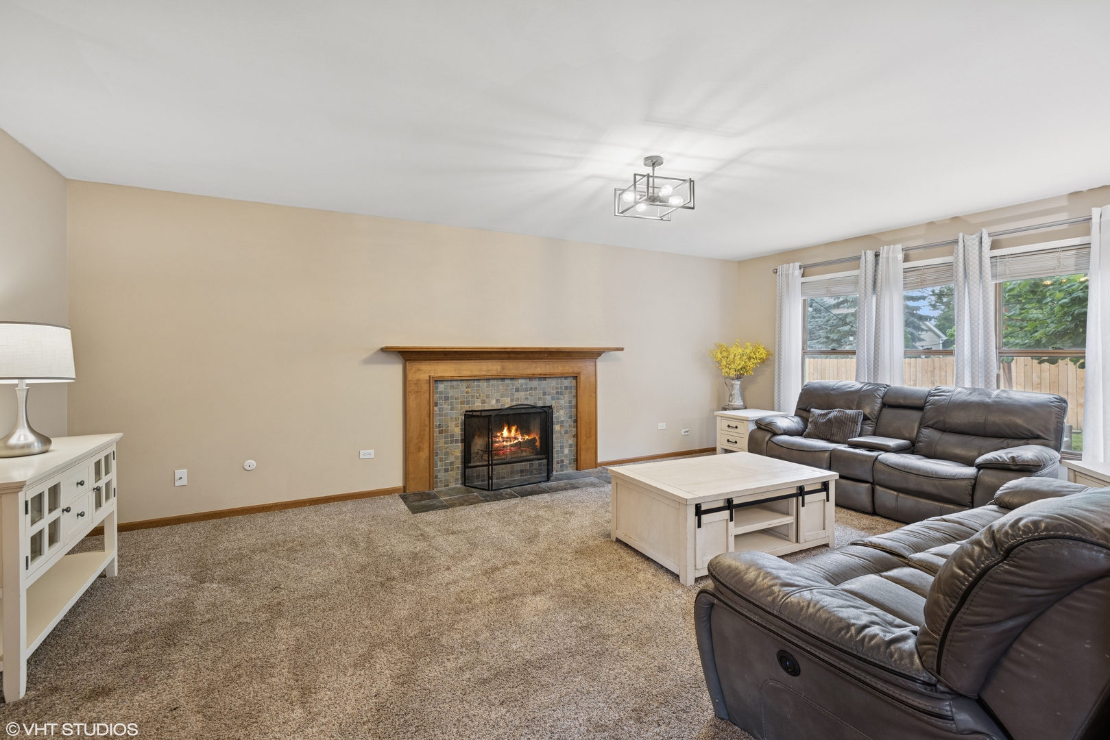 1177 Dovercliff Way Crystal Lake, IL 60014 - Photo 13 of 32 a living room with furniture and a fireplace