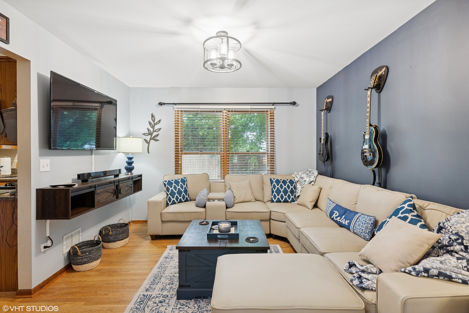 1177 Dovercliff Way Crystal Lake, IL 60014 - Photo 8 of 32 a living room with furniture ceiling fan and a flat screen tv