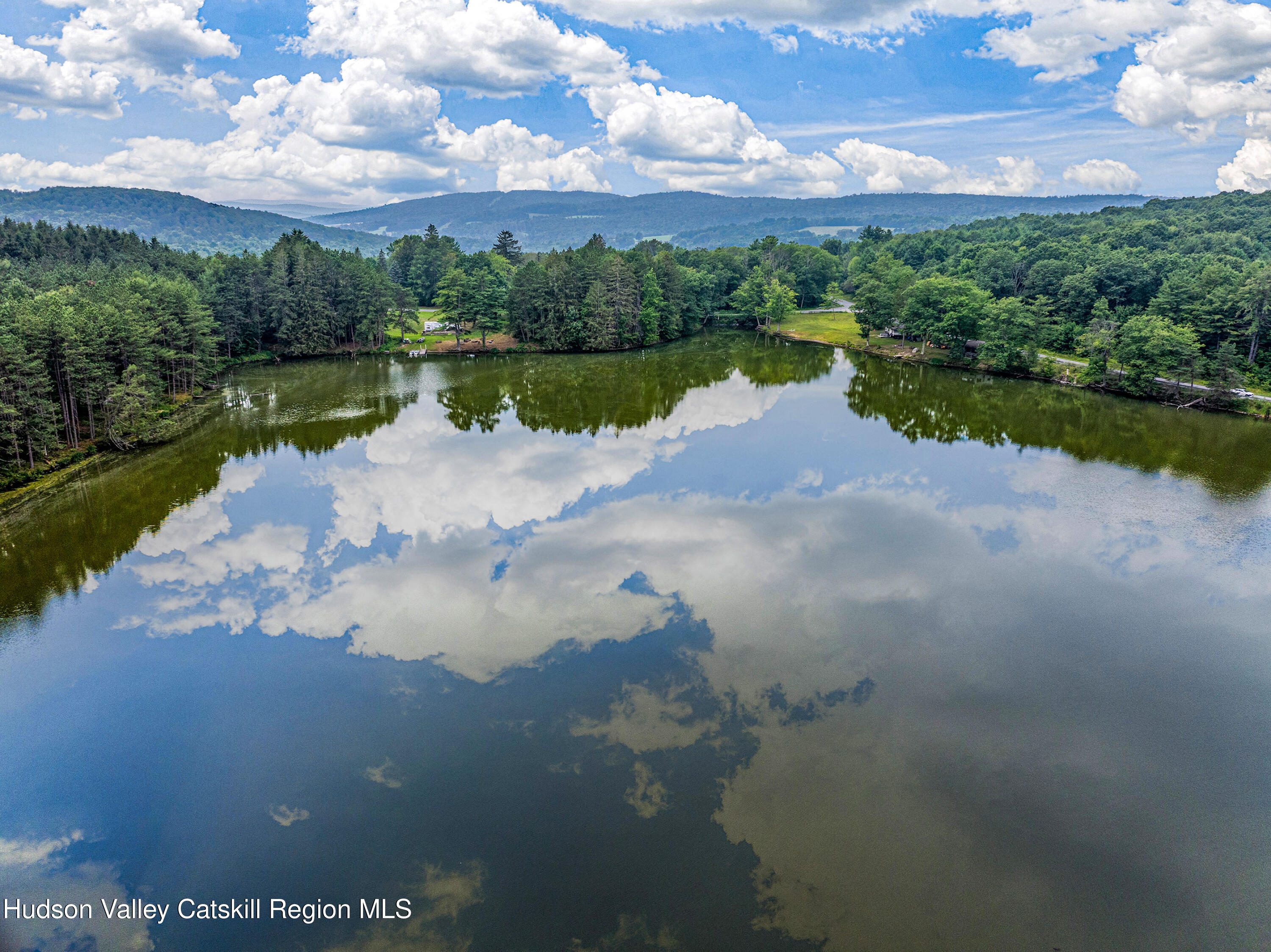 0 East Masonville Pond Road Sidney Center, NY 13839 - Photo 6 of 34 a view of a lake with houses in the back