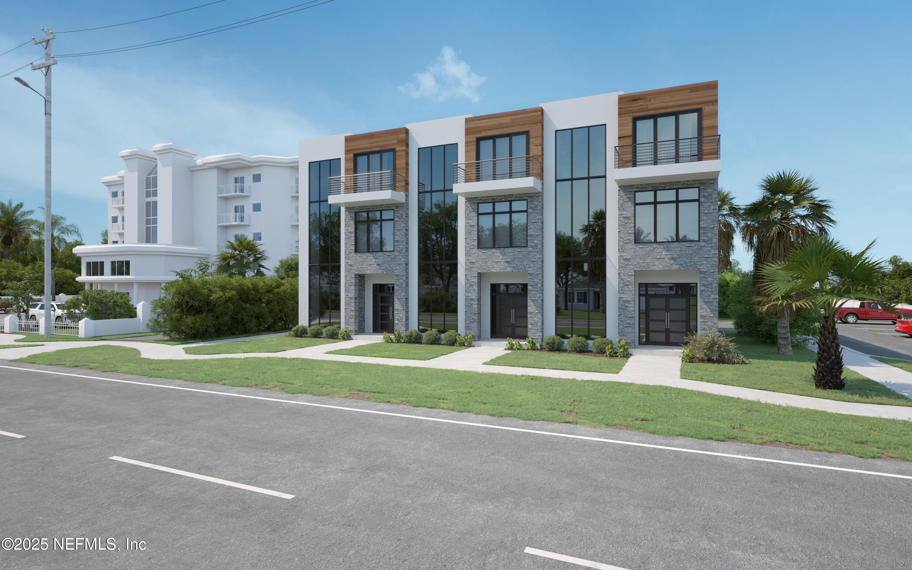 a view of a brick building next to a yard