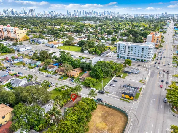 an aerial view of residential houses with outdoor space