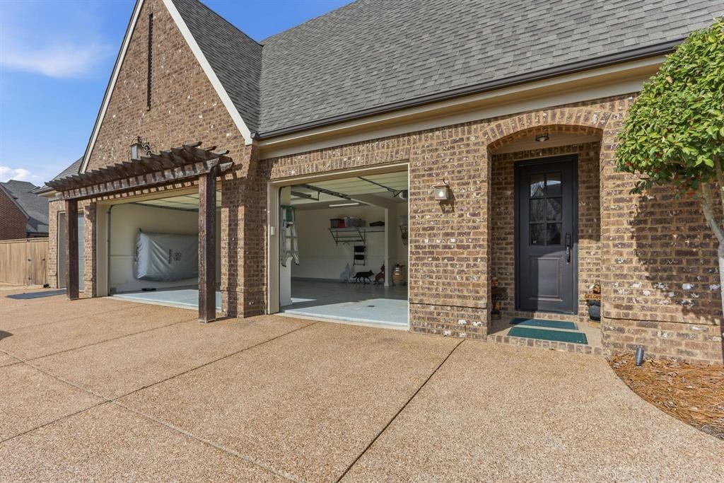 1301 Conser Street Collierville, TN 38017 - Photo 31 of 39 front view of a brick house with a porch