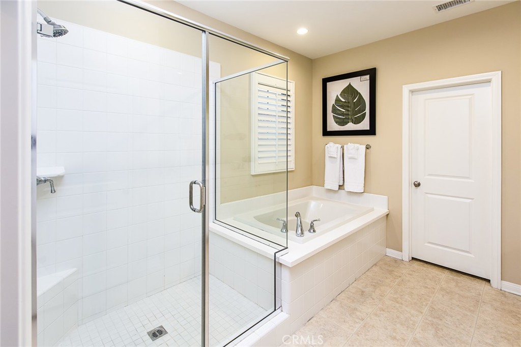 75 Gardenstone Path Irvine, CA 92620 - Photo 33 of 65 a bathroom with a bath tub and a shower