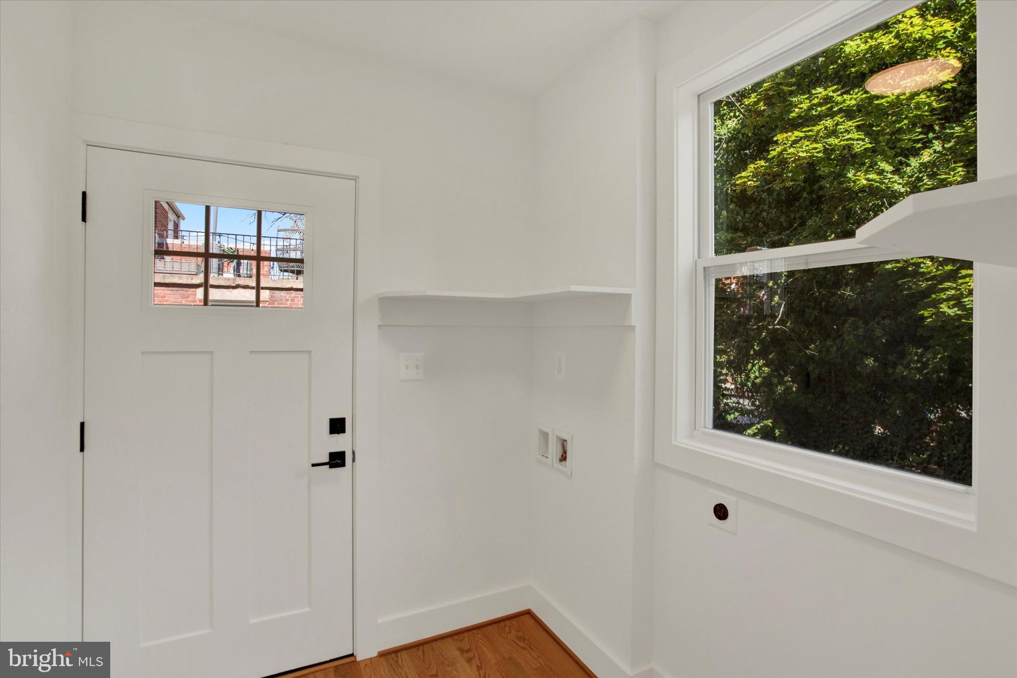2054 34th Street Southeast Washington, DC 20020 - Photo 13 of 43 a view of a small space with wooden floor and a window
