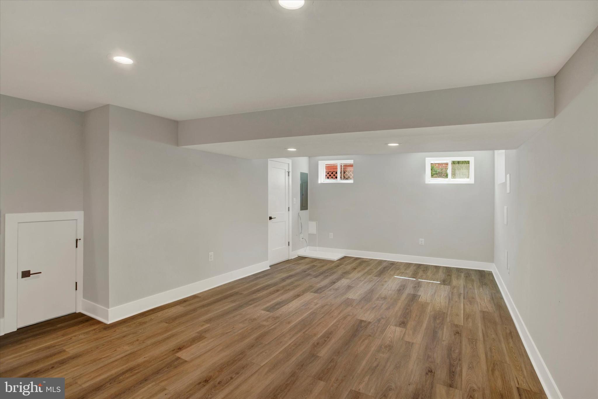 2054 34th Street Southeast Washington, DC 20020 - Photo 16 of 43 a view of an empty room with wooden floor