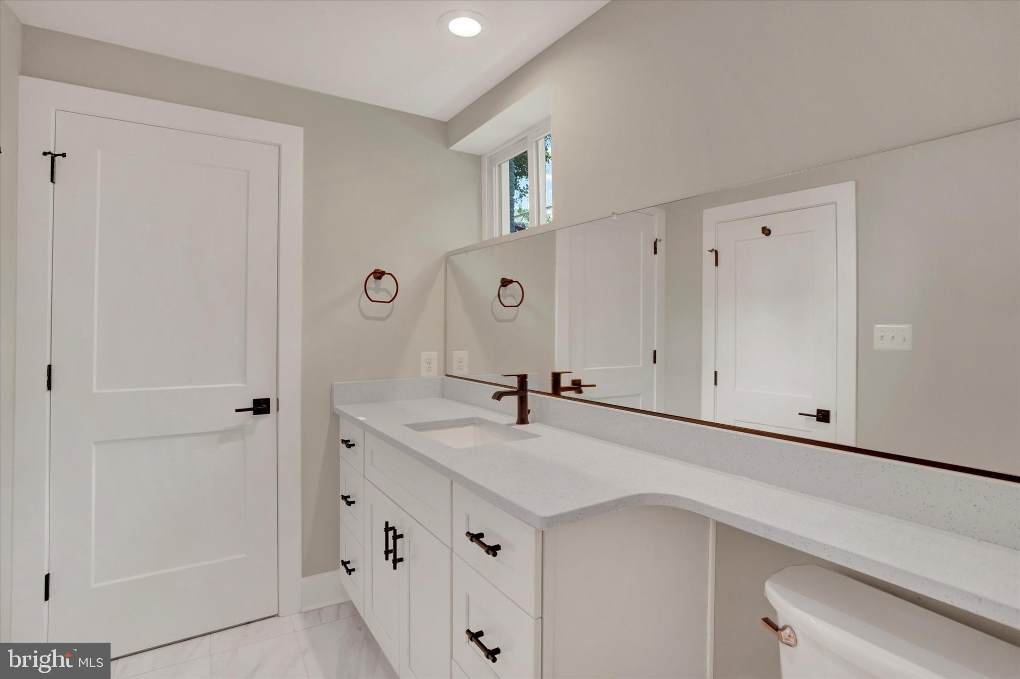 2054 34th Street Southeast Washington, DC 20020 - Photo 19 of 43 a view of cabinets with wooden floor