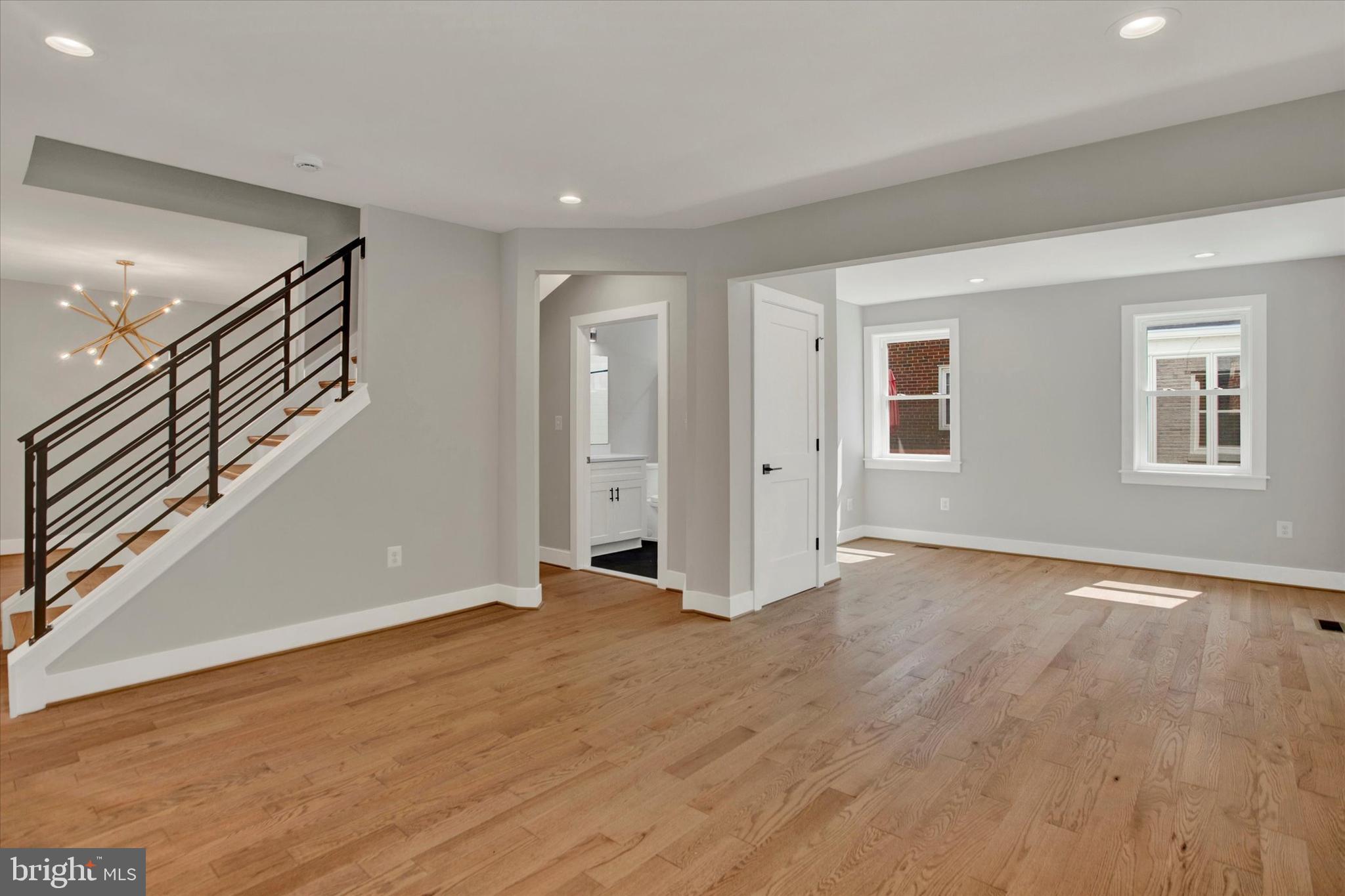 2054 34th Street Southeast Washington, DC 20020 - Photo 3 of 43 a view of an empty room with wooden floor and a window