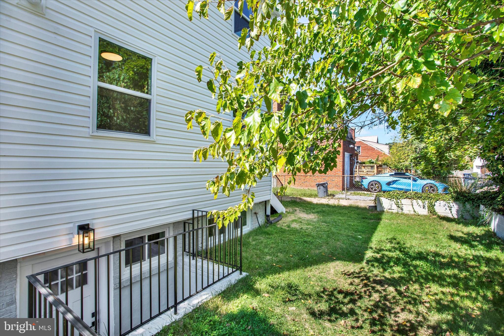 2054 34th Street Southeast Washington, DC 20020 - Photo 39 of 43 a front view of a house with a yard