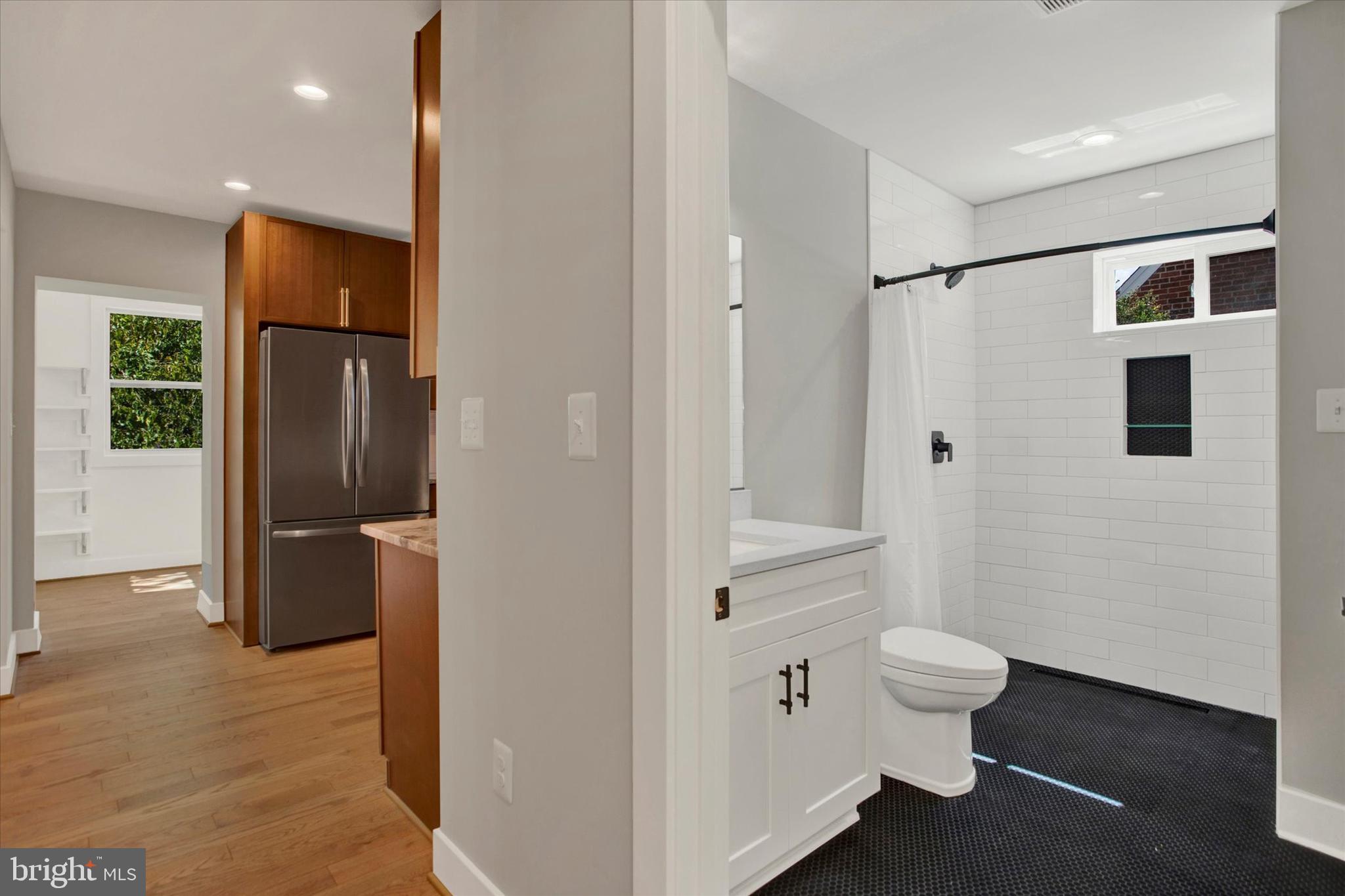 2054 34th Street Southeast Washington, DC 20020 - Photo 5 of 43 a bathroom with a sink and a mirror