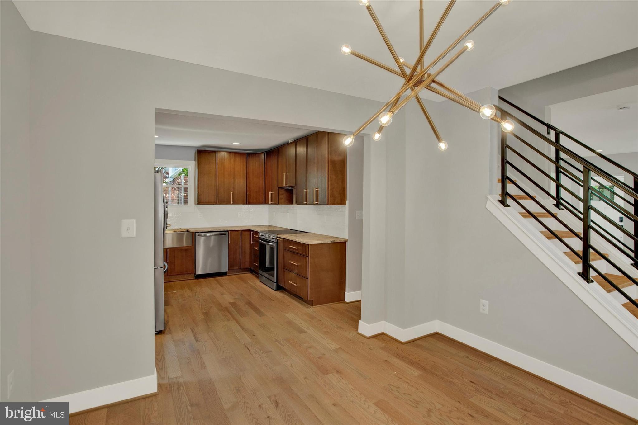 2054 34th Street Southeast Washington, DC 20020 - Photo 8 of 43 a view of a kitchen with a sink and a living room